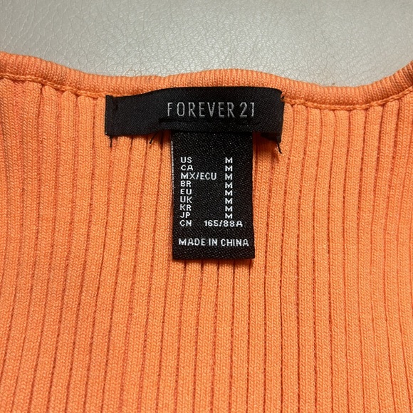 Cute orange crop top. Good condition size medium. - Picture 2 of 4